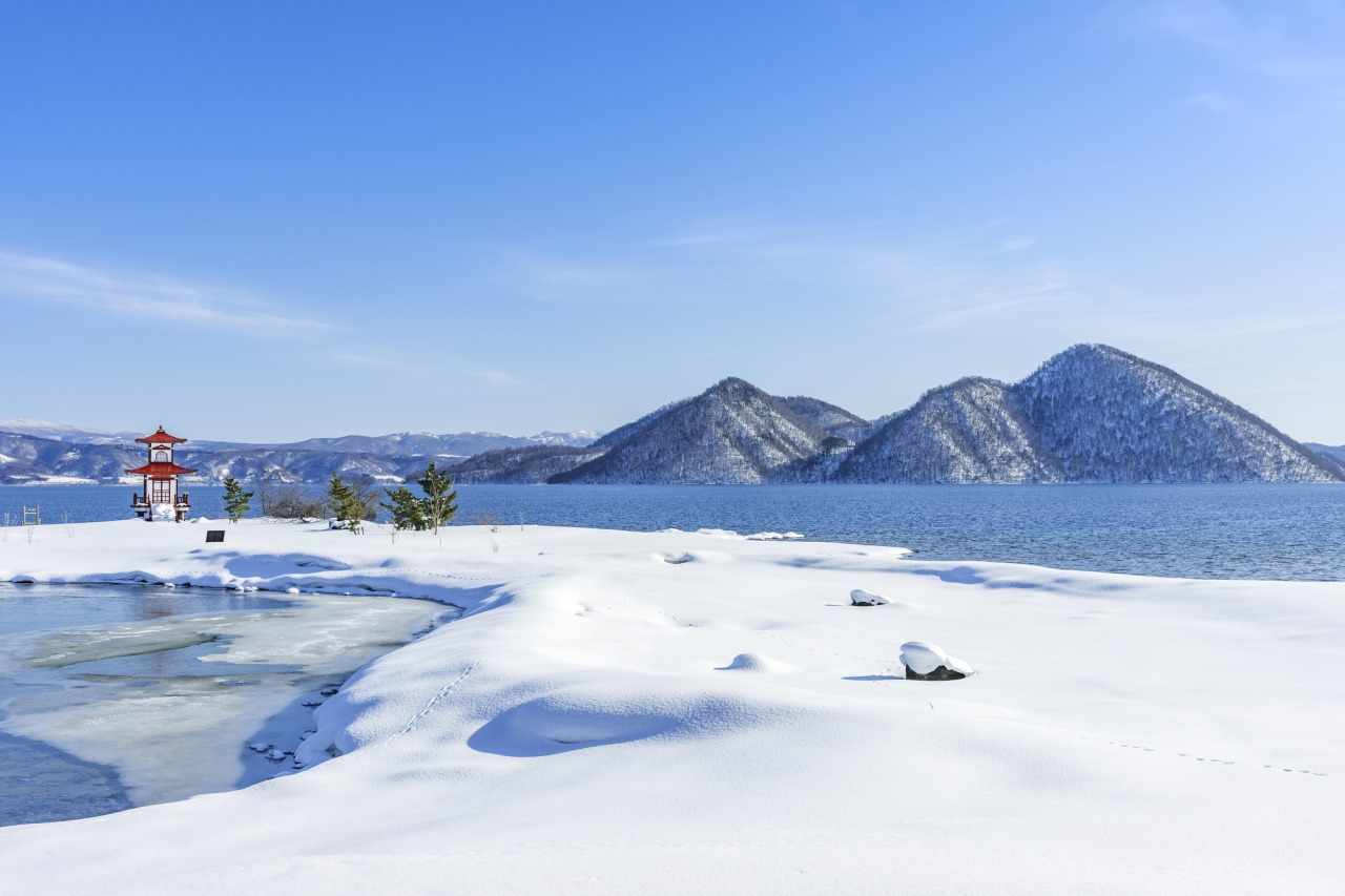 Snowfield pause above Lake Toya