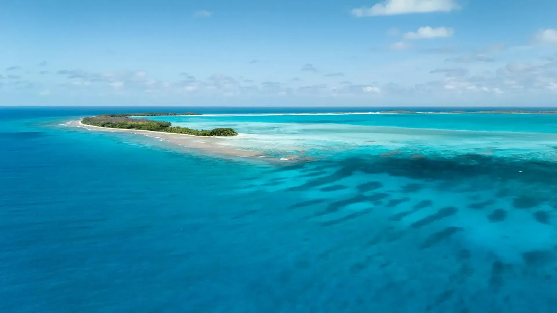Lagoon and islet in French Polynesia, seen from above