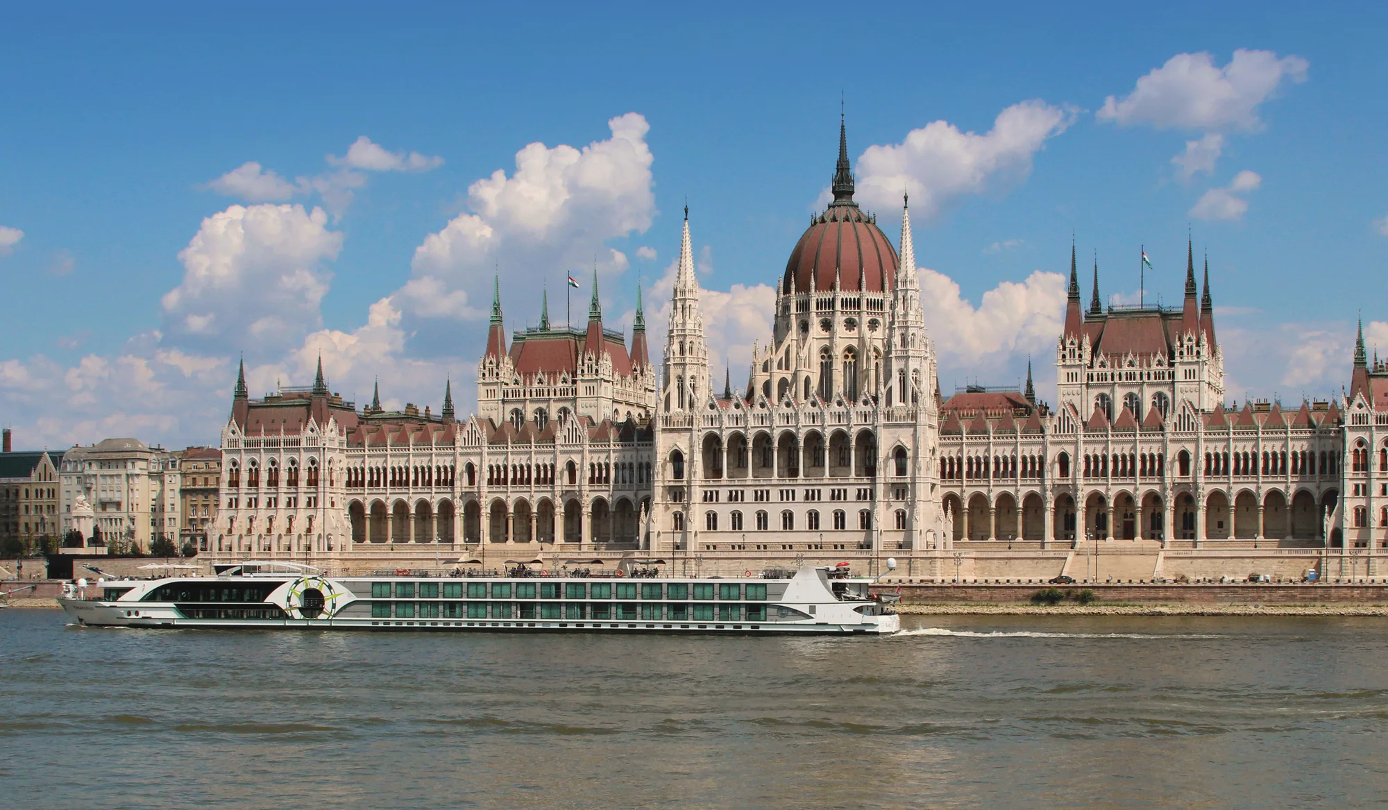 River ship passing the Hungarian Parliament in Budapest