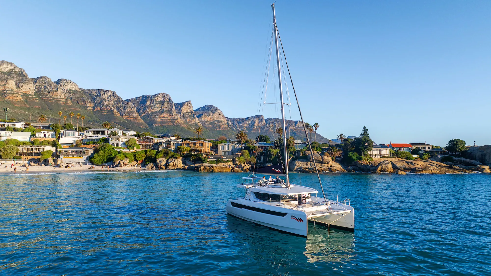 Catamaran at anchor in a sheltered bay
